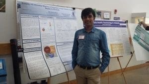 Nafiz Shuva standing with PhD Research Poster
